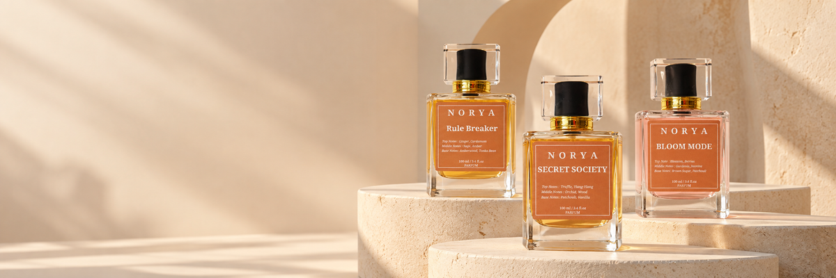 Norya fragrances displayed on sculptural ivory plinths